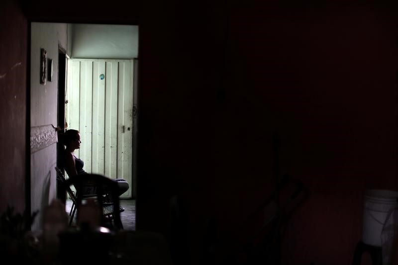 Yuleixis Hernandez, widow of Euvis Peroza, who died after members of the Special Action Force of the Venezuelan National Police (FAES) shot him, sits at her in-laws' home, in Barquisimeto, Venezuela September 19, 2019. Picture taken September 19, 2019. To match Special Report VENEZUELA-VIOLENCE/POLICE REUTERS/Ivan Alvarado - RC21BD9BNR2Q