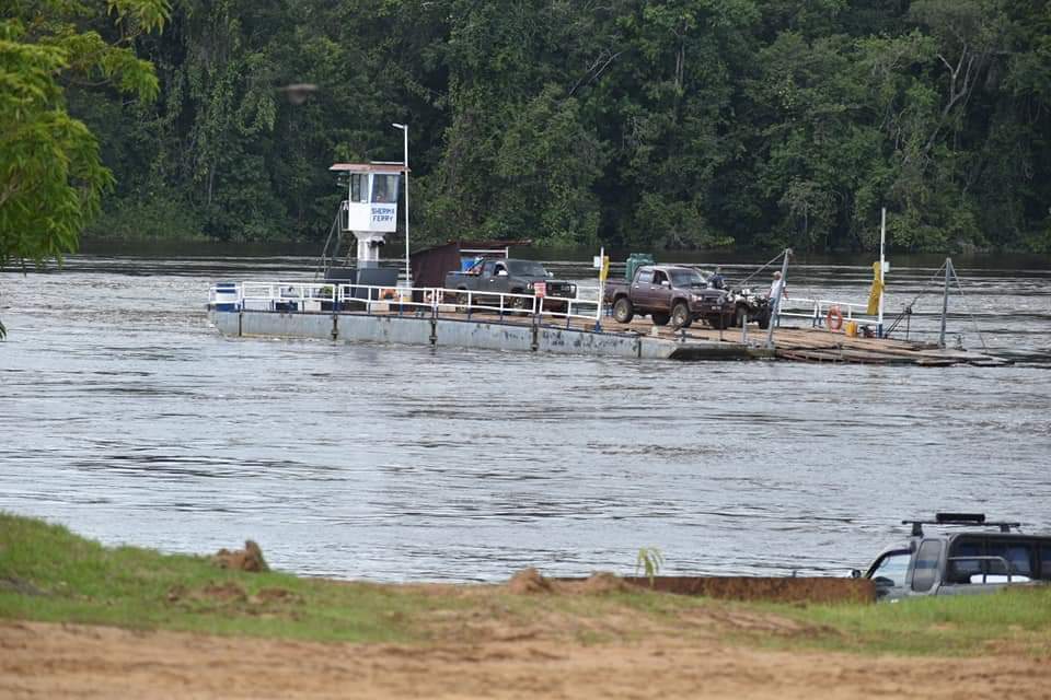 Vehicles on a ferry at the Sherima Crossing (RDC Region Seven Photo)