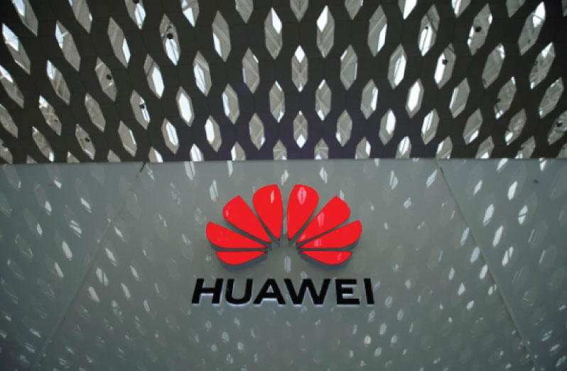 FILE PHOTO: A Huawei company logo is seen at the Shenzhen International Airport in Shenzhen in Shenzhen, Guangdong province, China June 17, 2019. To match Special Report HEALTH-CORONAVIRUS/BGI REUTERS/Aly Song/File Photo