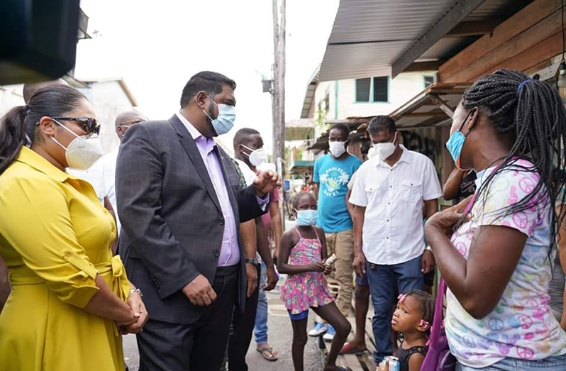President Irfaan Ali and First Lady, Arya Ali interacting with residents of Tiger Bay