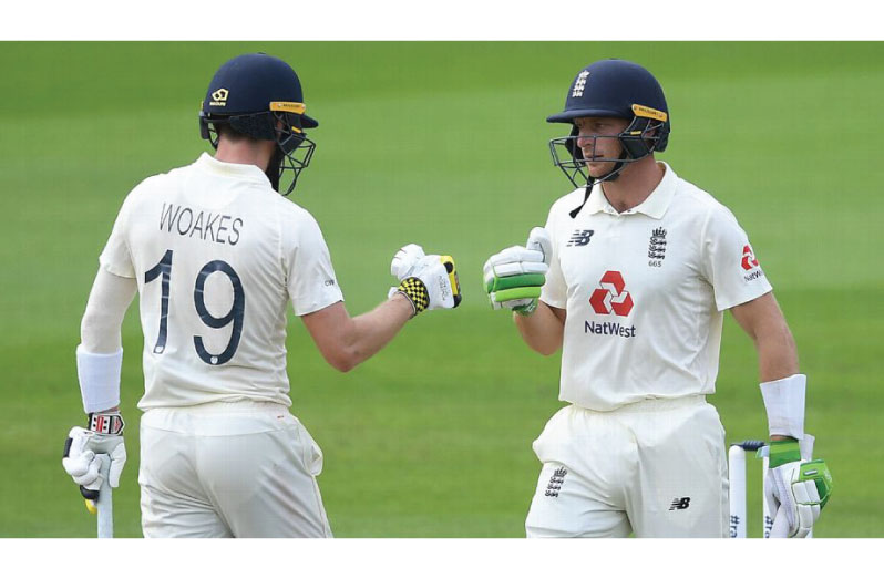 Jos Buttler and Chris Woakes punch gloves Getty Images
