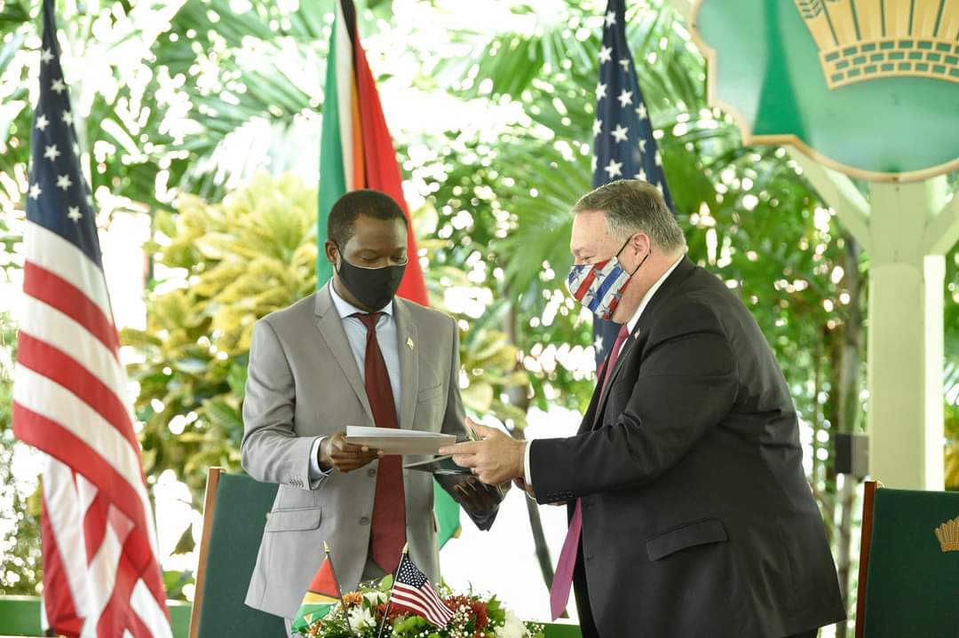 US Secretary of State Michael Pompeo and Minister of Foreign Affairs, Hugh Todd exchange documents after singing the agreements