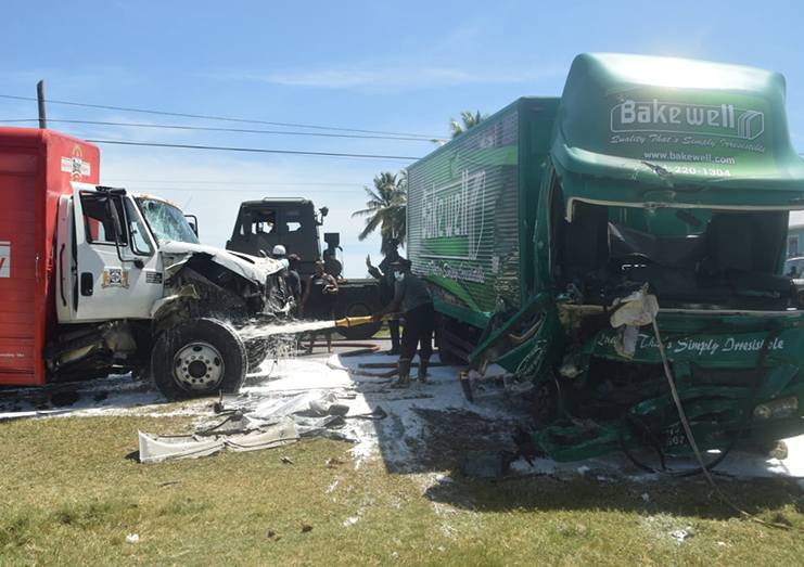 The two extensively damaged trucks and the damaged motor car in the aftermath of the accident.