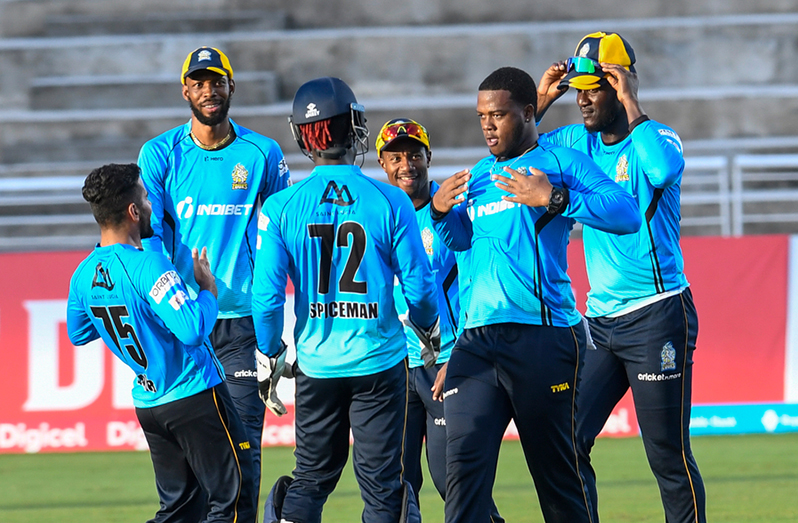 St Lucia Zouks players celebrate the fall of a wicket