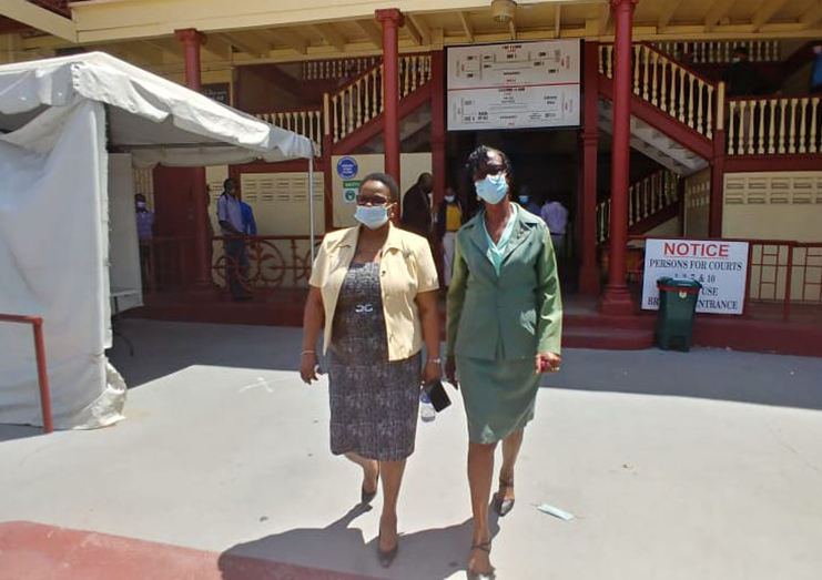 Peoples National Congress/Reform (PNC/R) Chairman, Volda Lawrence and APNU+AFC representative, Carol Joseph leave the Georgetown Magistrates’ Court together.  (Lisa Hamilton photo)