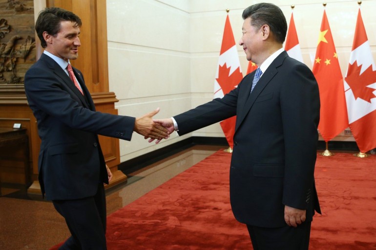 Canada’s President Justin Trudeau greets China’s President Xi Jinping [File: Wu Hong/EPA]