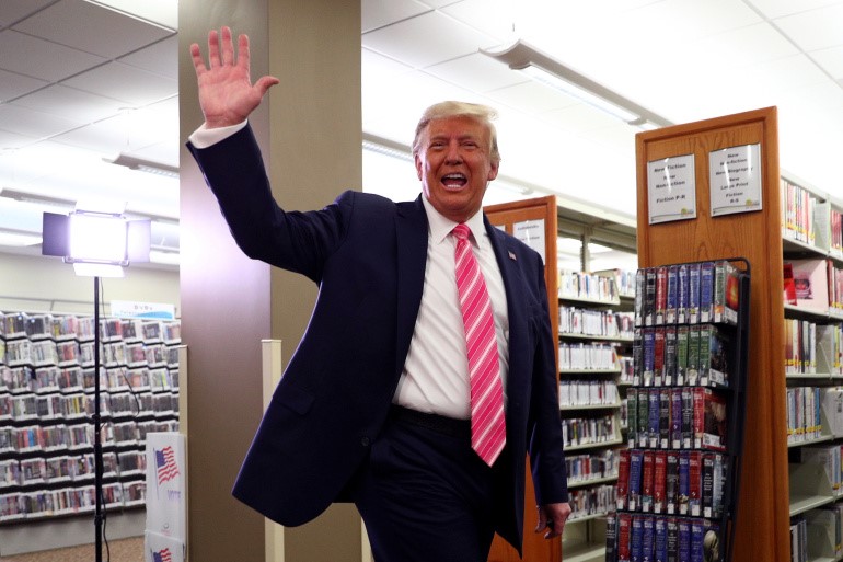 President Donald Trump waves after voting in the 2020 presidential election at the Palm Beach County Library in West Palm Beach, Florida [Tom Brenner/Reuters]