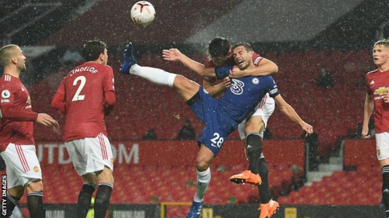 Man Utd captain Harry Maguire escaped punishment for this first-half challenge on Chelsea skipper Cesar Azpilicueta 