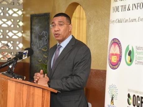 Prime Minister, Andrew Holness, addressing a ceremony for the handover of tablets to students of the Drews Avenue Primary and Infant School in St Andrew on November 4, 2020 - Contributed photo.