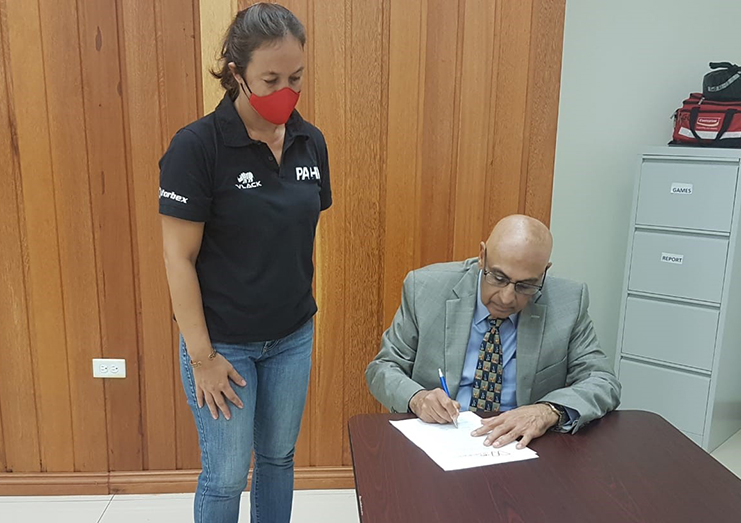 President of the GOA, Kalam Juman signs the declaration on October 5, 2020 along with Assistant Treasurer, Tricia Fiedtkou