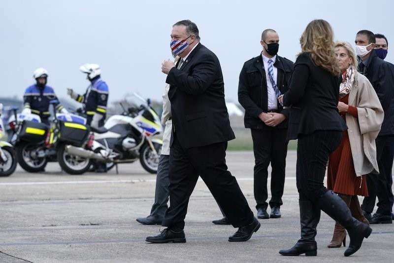 U.S. Secretary of State Mike Pompeo, left, walks to a motorcade vehicle after stepping off a plane at Paris Le Bourget Airport, Saturday, Nov. 14, 2020, in Le Bourget, France. Pompeo is beginning a 10-day trip to Europe and the Middle East. (AP Photo/Patrick Semansky, Pool)