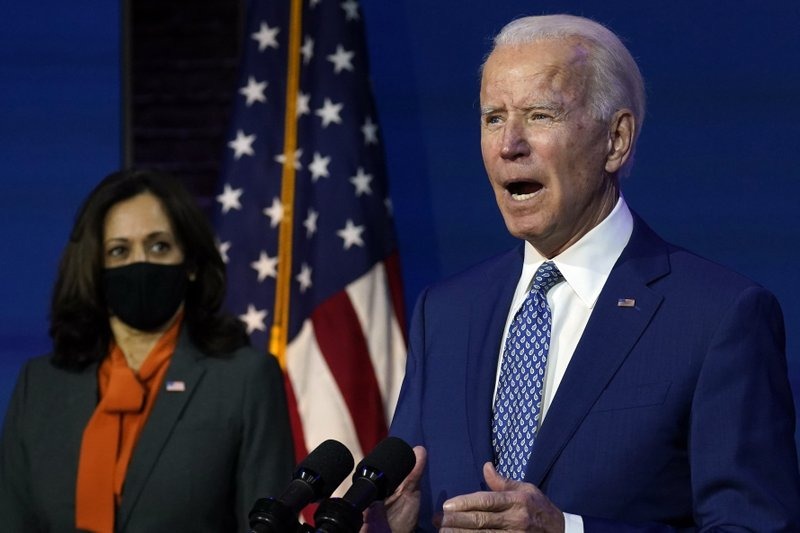 President-elect Joe Biden, joined by Vice President - elect Kamala Harris, speaks at The Queen Theatre, Monday, Nov. 9, 2020, in Wilmington, Del. (AP photo/ Carolyn Kaster)