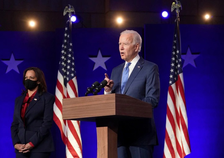 Democratic presidential nominee Joe Biden speaks about election results next to vice presidential nominee Kamala Harris in Wilmington, Delaware on Friday [Kevin Lamarque/Reuters]