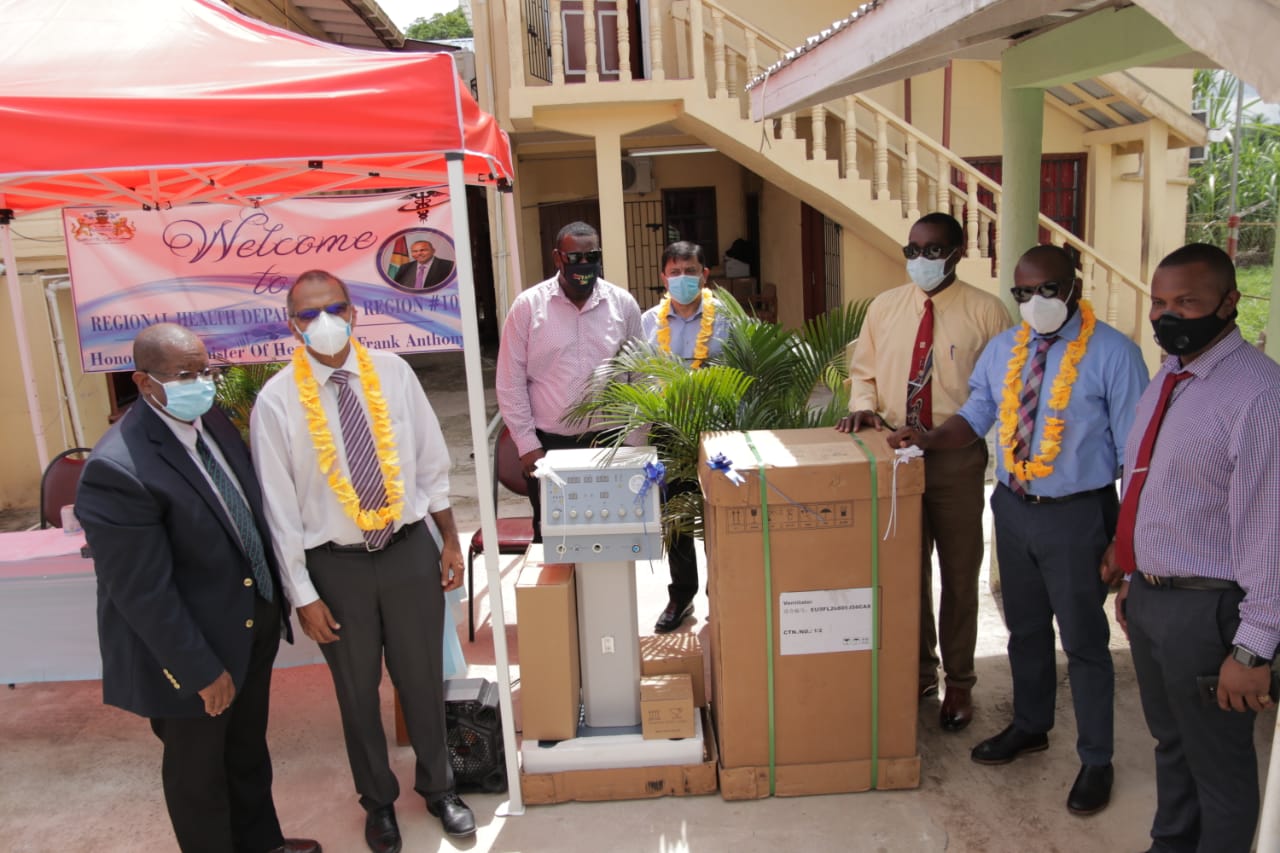 Minister of Health, Hon. Dr. Frank Anthony hands over the ventilator and oxygen concentrator to the Regional Health Department of Region Ten to boost COVID-19 treatment. (DPI)
