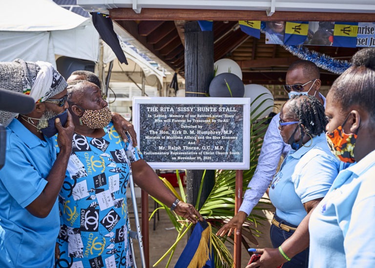 It was an emotional scene for family members of the late Rita ‘Sissy’ Hunte, as they unvieled a plaque and newly renamed stall in memory of their loved one. (Barbados Today)