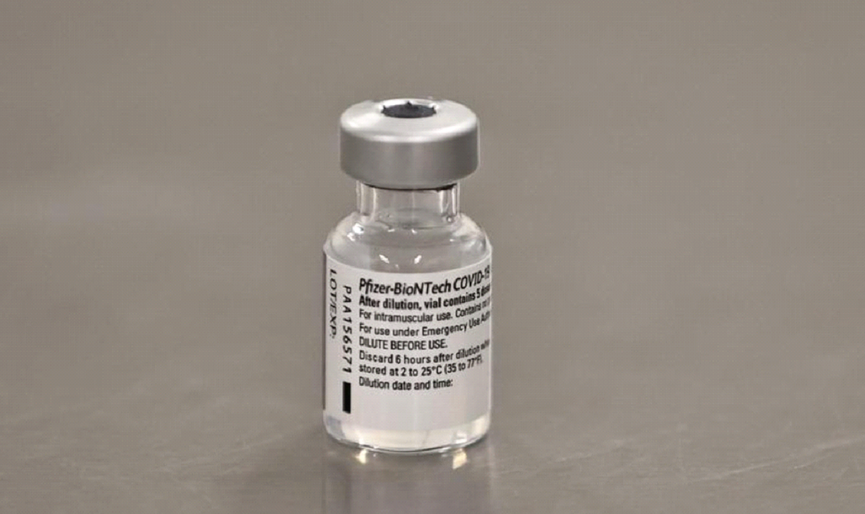 FILE PHOTO: A vial of the Pfizer/BioNTech COVID-19 vaccine is seen ahead of being administered at the Royal Victoria Hospital, on the first day of the largest immunisation programme in the British history, in Belfast, Northern Ireland December 8, 2020. Liam McBurney/Pool via REUTERS/File Photo
