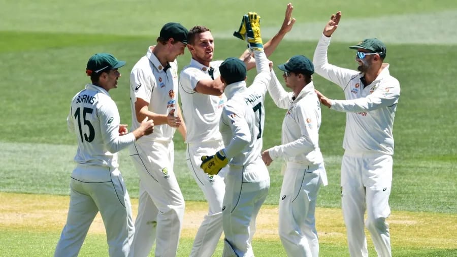 A jubilant Josh Hazlewood is congratulated by team-mates after his devastating strikes  (Getty Images)