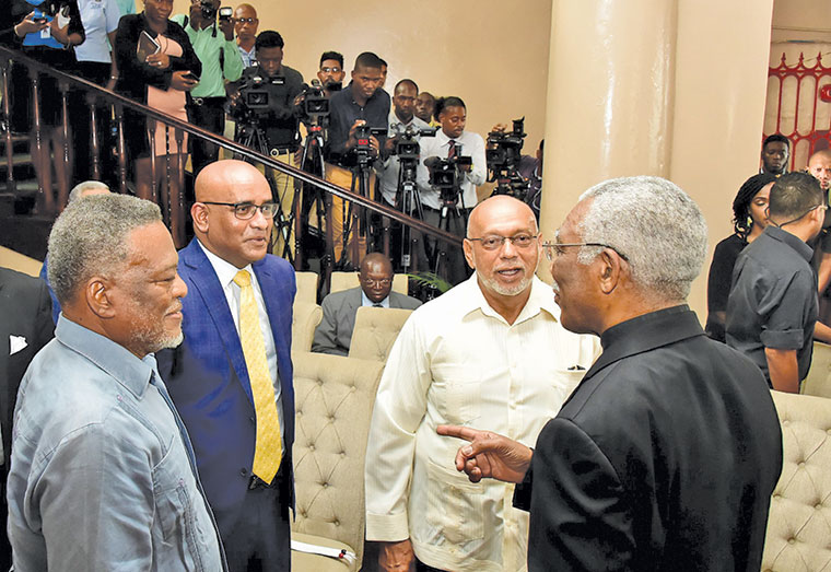 Former Presidents: David Granger; Bharrat Jagdeo, Donald Ramotar and Samuel Hinds share a light moment at ceremony at Parliament Buildings May 2019