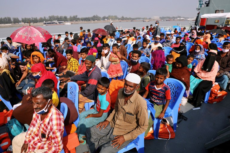 Rohingyas are seen on a ship as they are moved to Bhasan Char island [Reuters]
