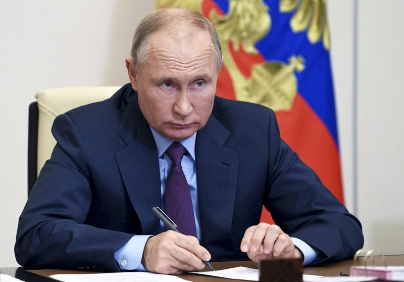 Russian President Vladimir Putin attends a meeting of the Council for Civil Society and Human Rights via a video conference at the Novo-Ogaryovo residence outside Moscow, Russia, Thursday, Dec. 10, 2020. (Alexei Nikolsky, Sputnik, Kremlin Pool Photo via AP)