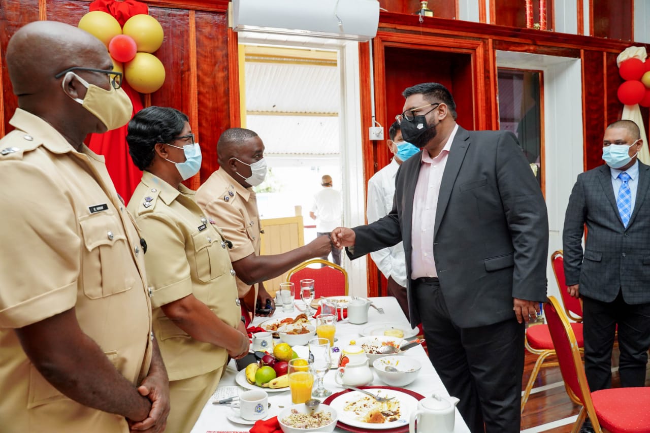 President Irfaan Ali greeting senior members of the Guyana Police Force during Wednesday’s breakfast