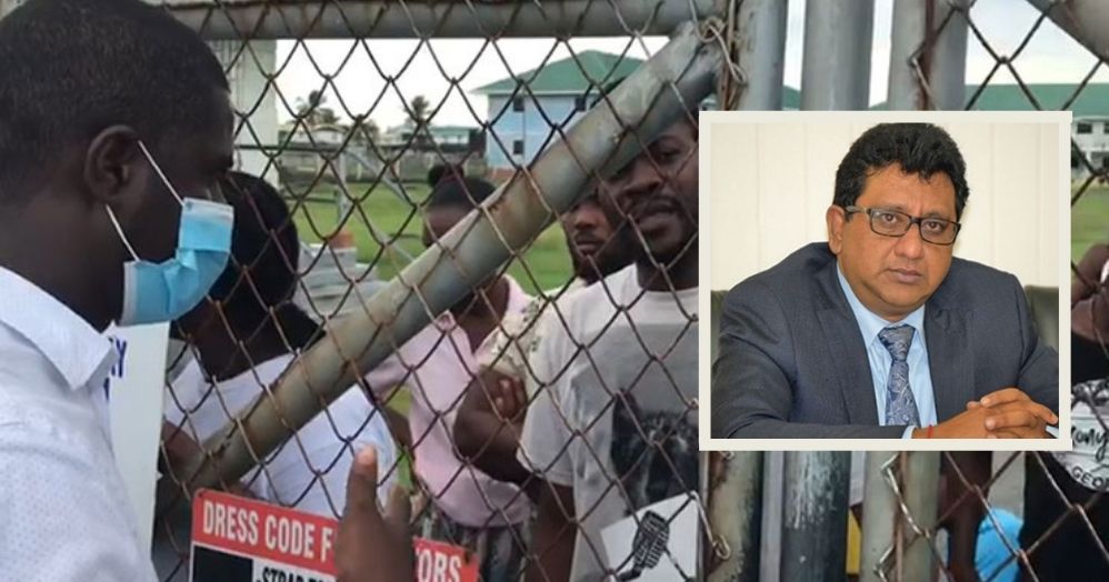 Attorney-at-Law, Darren Wade speaks to the Haitian nationals previously detained at the Hugo Chavez Centre. On the right of the photo is Attorney General (AG), Anil Nandlall.