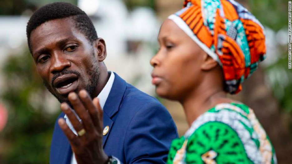 Bobi Wine addresses the media next to his wife Barbara, as security forces surround their home on January 15, 2021 in Kampala (CNN)