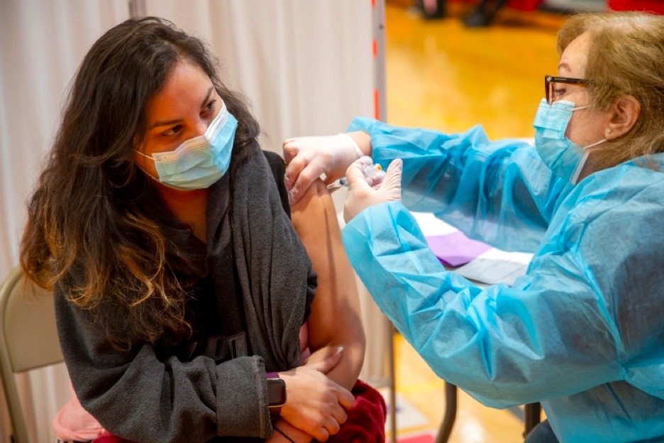 A person receives the Moderna COVID-19 vaccine in the United States [Ted Shaffrey/AP Photo]