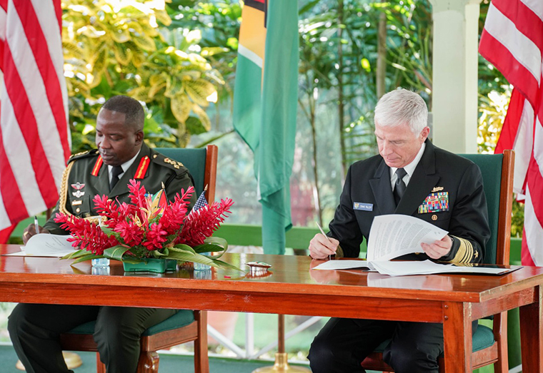 Chief of Staff of the Guyana Defense Force (GDF), Brigadier Godfrey Bess (left) and Commander of the U.S. Southern Command, Admiral Craig S. Faller sign the Acquisition and Cross Servicing Agreement.
