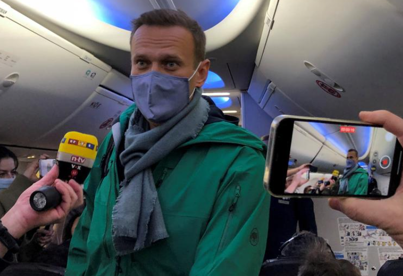 FILE PHOTO: FILE PHOTO: Russian opposition leader Alexei Navalny is seen on board a plane before the departure for the Russian capital Moscow at an airport in Berlin, Germany January 17, 2021. REUTERS/Polina Ivanova/File Photo