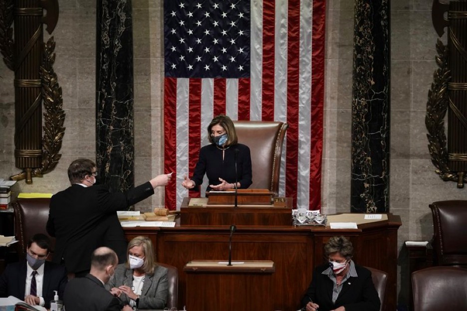 Speaker of the House Nancy Pelosi, D-Calif., leads the final vote of the impeachment of President Donald Trump, for his role in inciting an angry mob to storm the Congress last week, at the Capitol in Washington, Wednesday, Jan. 13, 2021. (AP Photo/J. Scott Applewhite)