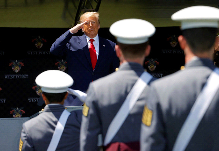 US President Donald Trump salutes as he prepares to deliver the commencement address at the 2020 United States Military Academy Graduation Ceremony in West Point, New York, US [File: Mike Segar/ Reuters]