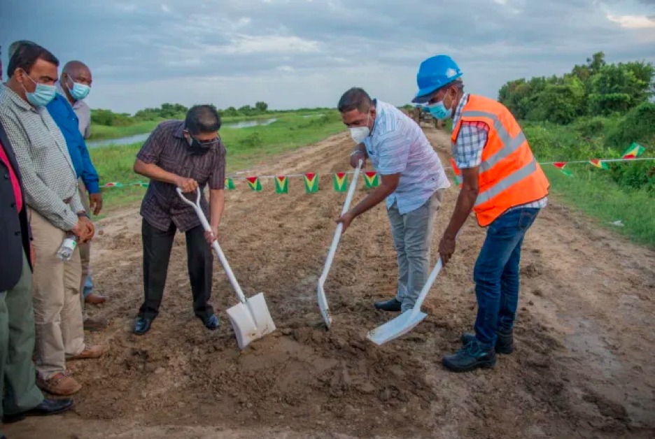 Minister of Finance Dr. Ashni Singh and Minister of Agriculture Zulfikar Mustapha turn the sod for the start of the road project (DPI)