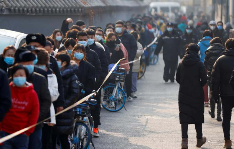 People line up to get their nucleic acid test following the outbreak of the coronavirus disease (COVID-19) in Beijing, China January 22, 2021. REUTERS/Carlos Garcia Rawlins