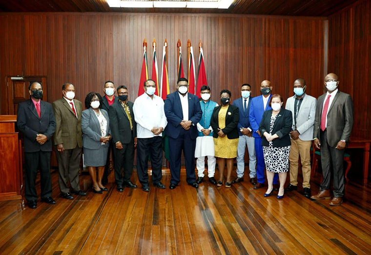 President Irfaan Ali (Centre) with the newly sworn in Mayors on Friday. Minister of Local Government and Regional Development Nigel Dharamlall and Minister of Parliamentary Affairs and Governance are also photographed. (OP)