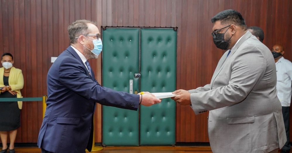 President Irfaan Ali (right) receives Letters of Credence from newly appointed Canadian High Commissioner to Guyana, Mark Berman
