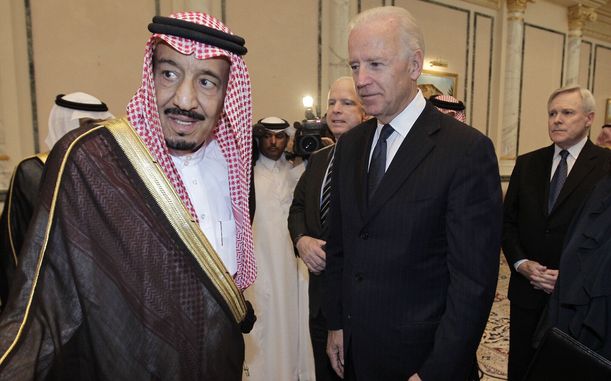 FILE - In this Thursday, Oct. 27, 2011 file photo, U.S. Vice President Joe Biden, right, offers his condolences to Prince Salman bin Abdel-Aziz  upon the death of on his brother  Saudi Crown Prince Sultan bin Abdul-Aziz Al Saud,  at Prince Sultan palace in Riyadh, Saudi Arabia. Saudi Arabia has named a new defense minister to replace the late crown prince who held the post. King Abdullah appointed Prince Salman bin Abdul-Aziz Al Saud minister of defense and aviation on Saturday. Prince Salman replaces Crown Prince Sultan, who died Oct. 22. (AP Photo/Hassan Ammar, File)