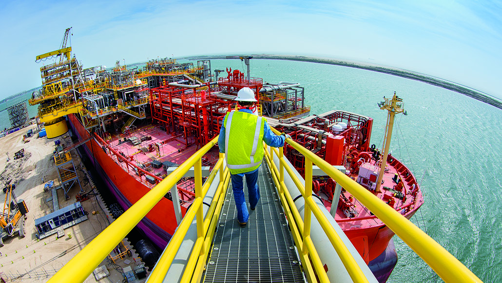 A worker approaches one of the MWCC's rapid-response vessels that can be deployed to capture, process, store and offload liquids during a subsea incident.