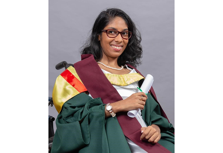Rajni Persaud poses for her official graduation portrait at the University of Guyana's Turkeyen 
Campus