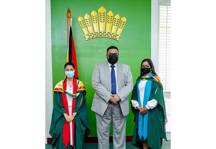 President Ali flanked by the two valedictorians; 24-year-old Deepa Odit from the Turkeyen Campus (left) who completed a Bachelor of Science Degree in Pharmacy and attained a 3.9 GPA and 36-year-old Savitree Budram from the Tain Campus, who completed a Bachelor of Education – Administration and attained a GPA of 4.0.