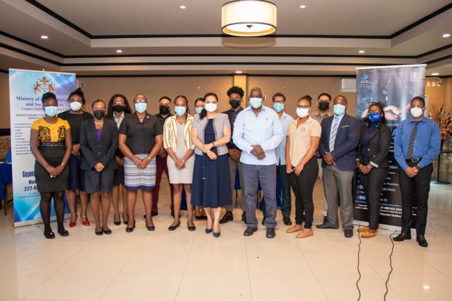 Minister of Home Affairs, Robeson Benn and Minister of Human Services and Social Security, Dr. Vindhya Persaud with participants of the workshop