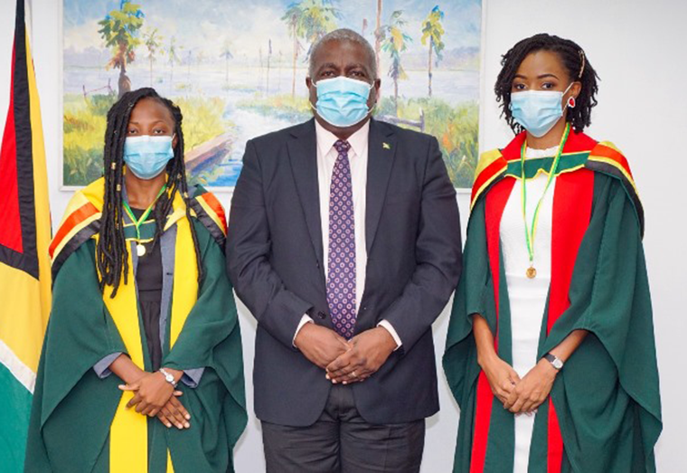 Best graduating student in the School of Medicine, Dr Jonelle Europe and best graduating student in the Faculty of Social Science with a Degree in Public Management, Ms Desiree Noble  and Prime Minister, Mark Phillips