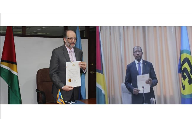 (L-R) CARICOM Secretary-General Ambassador Irwin LaRocque and Guyana’s new Ambassador to CARICOM H.E. George Talbot.