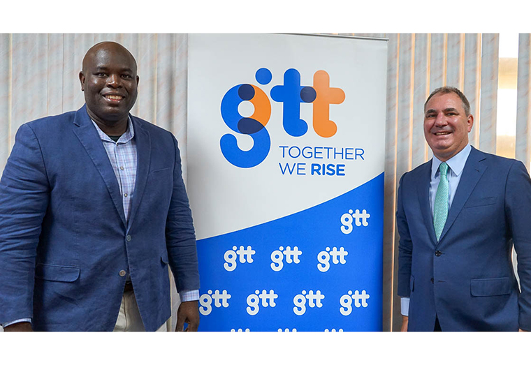 Outgoing CEO of GTT, Justin Nedd stands besides the incoming CEO, Damian Blackburn