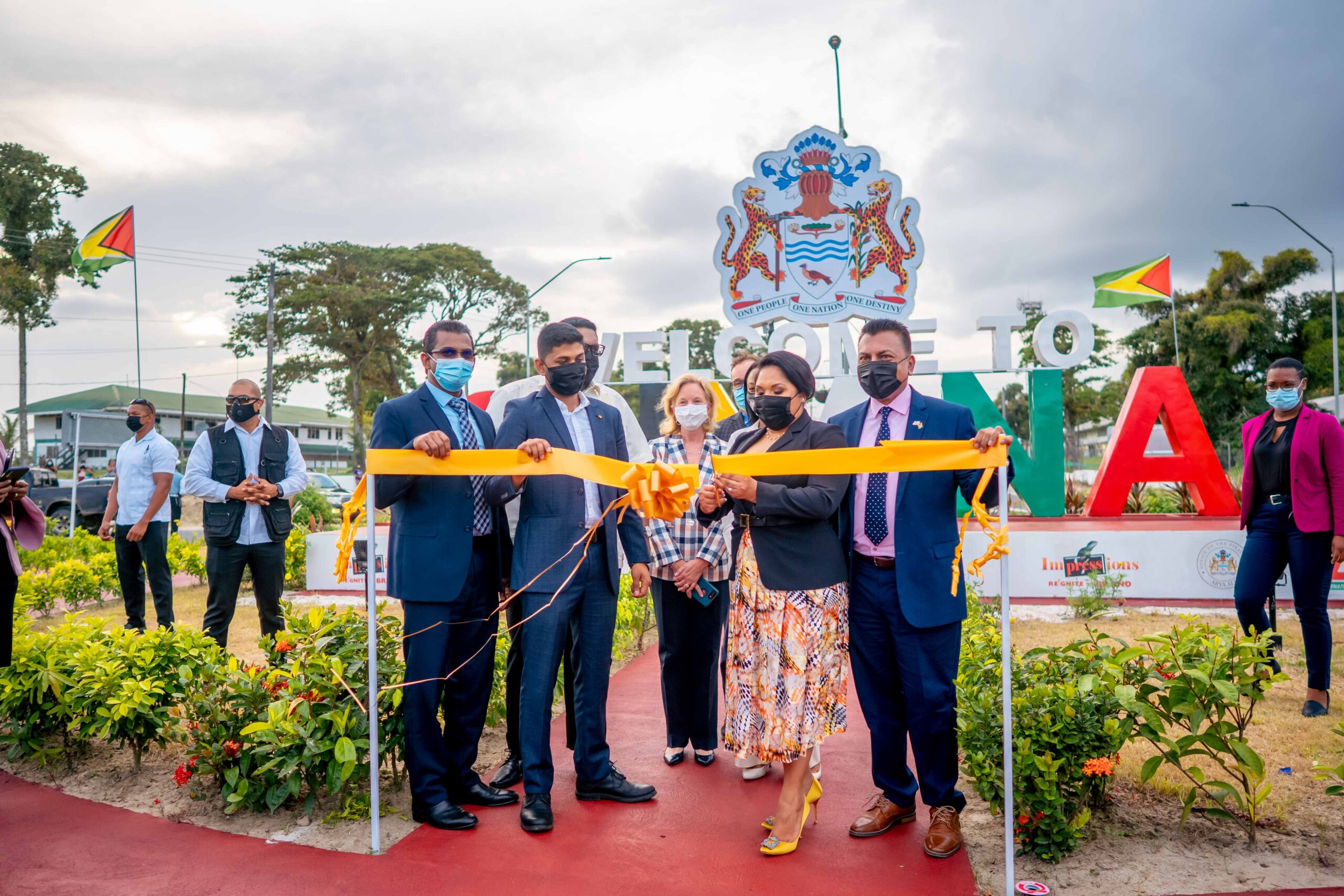 The First Lady Arya Ali commissioning the $25M Welcome to Guyana sign at CJIA in the presence of a number of officials, and diplomats