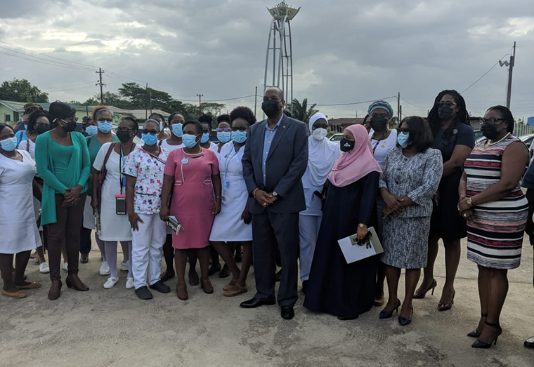 Opposition Leader Joseph Harmon (center) flanked by some of the nurses who are on protest at the Linden Hospital Complex. Also in photo are APNU+AFC Members of Parliament