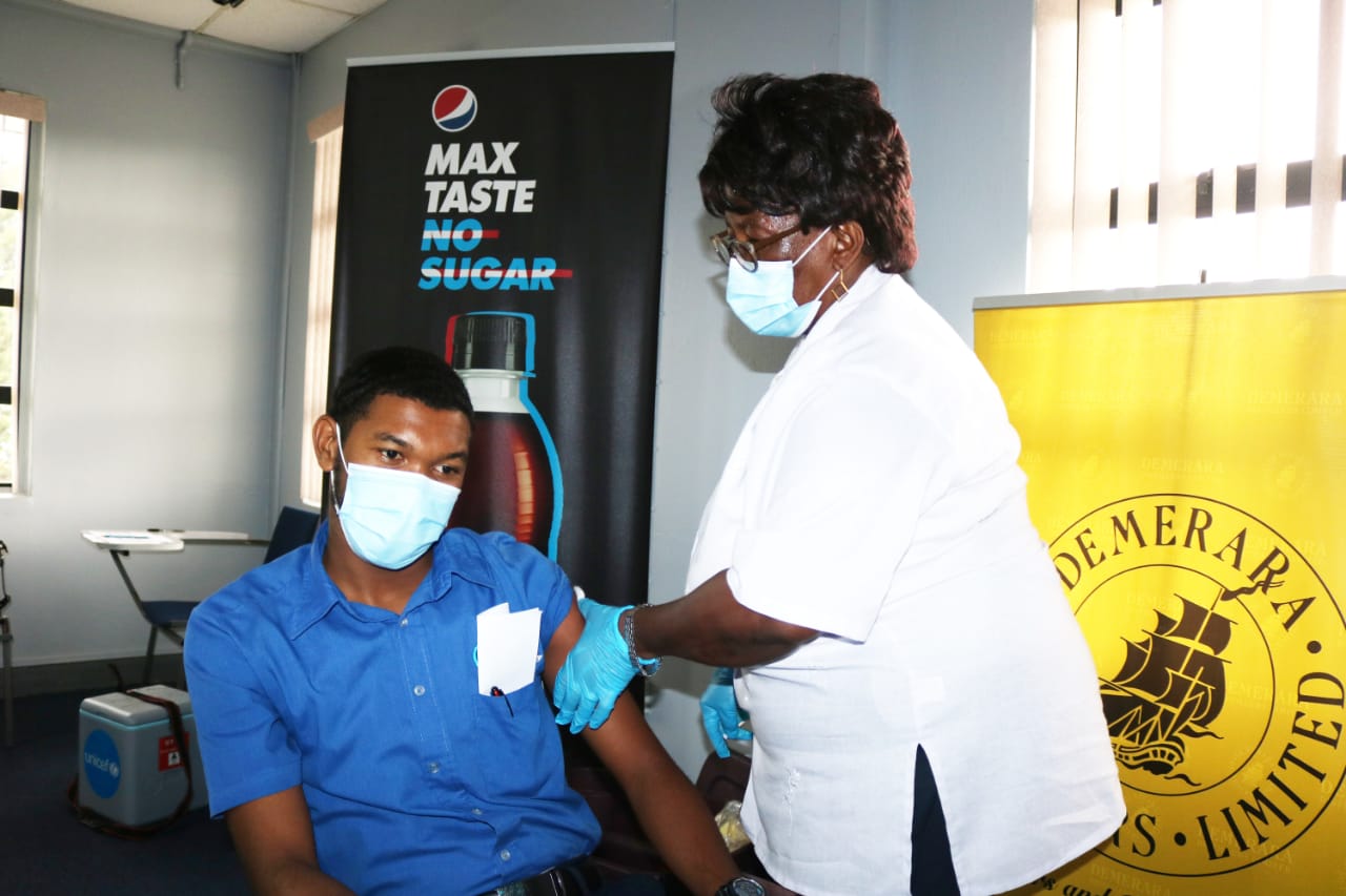 A DDL staff receiving the vaccine