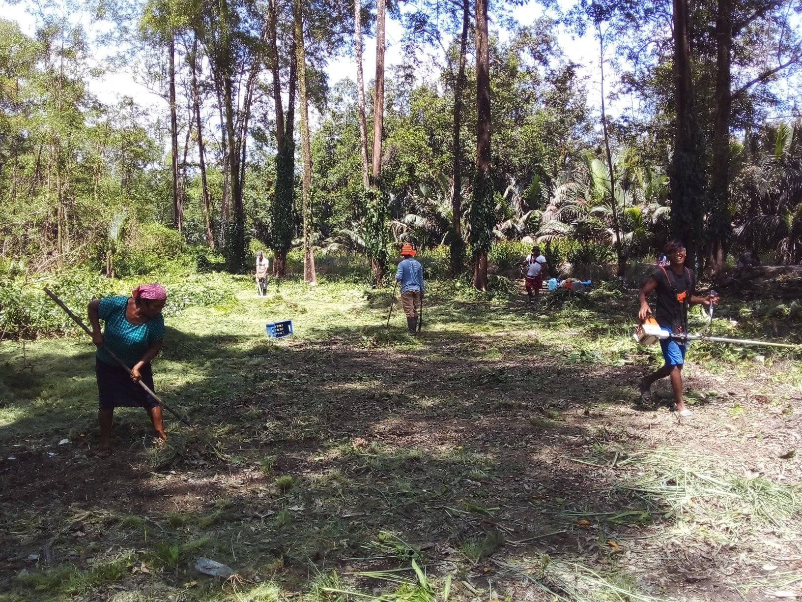 Residents of Morawhanna
 engaged in the clearing of land where the community’s first ever playfield will be built.