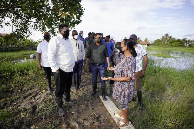 President Irfaan Ali during a visit to a flooded community