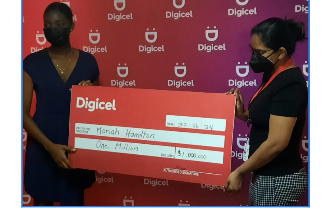 Ms Vidya Sanichara of Digicel Guyana presenting cheque of one million dollars to Moriah Hamilton